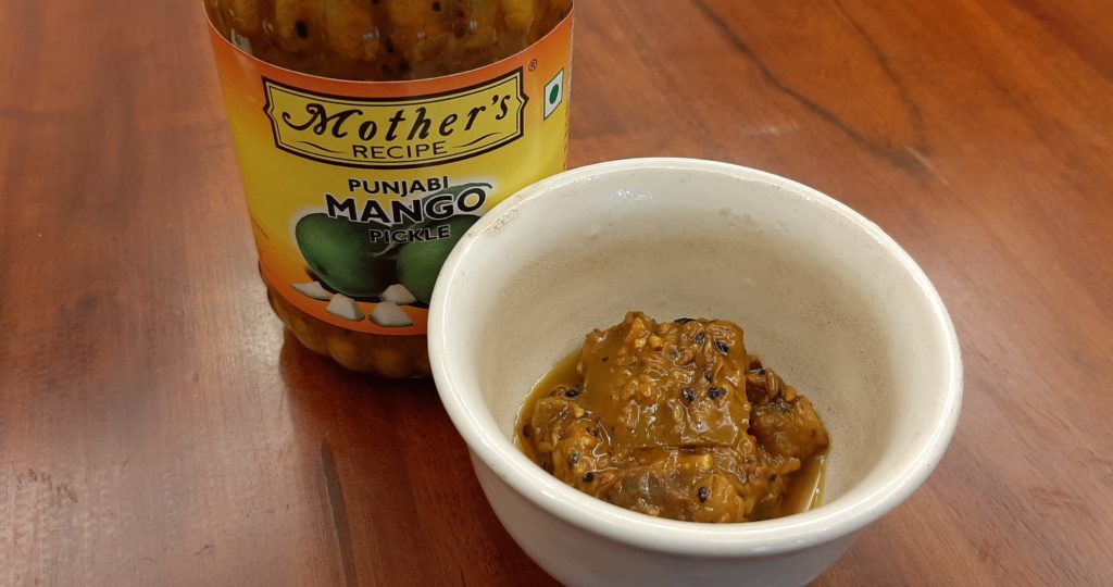 mother’s recipe punjabi mango pickle in a bowl