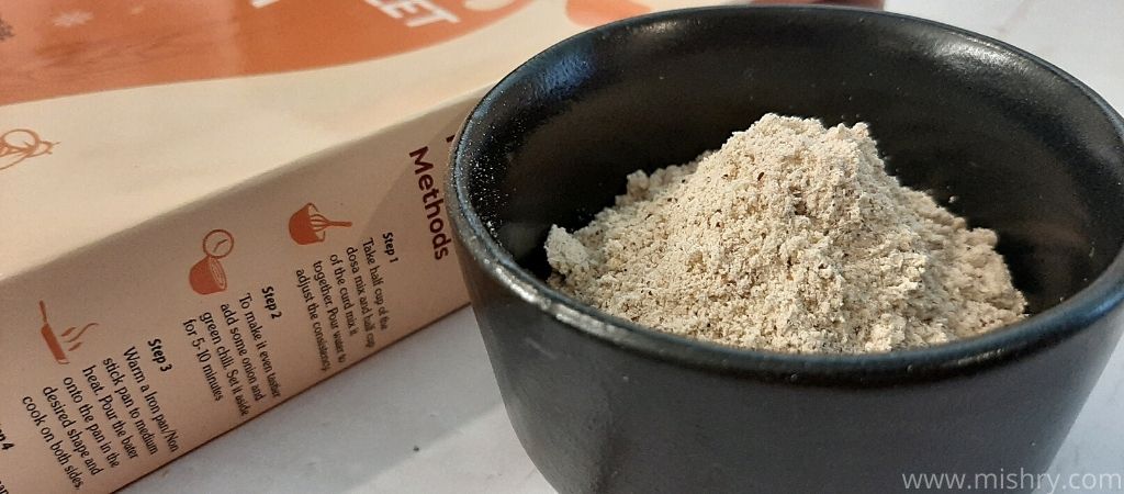 multi millet dosa packet contents in a bowl