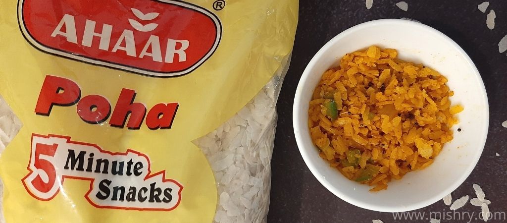ahaar poha packet with cooked poha filled bowl