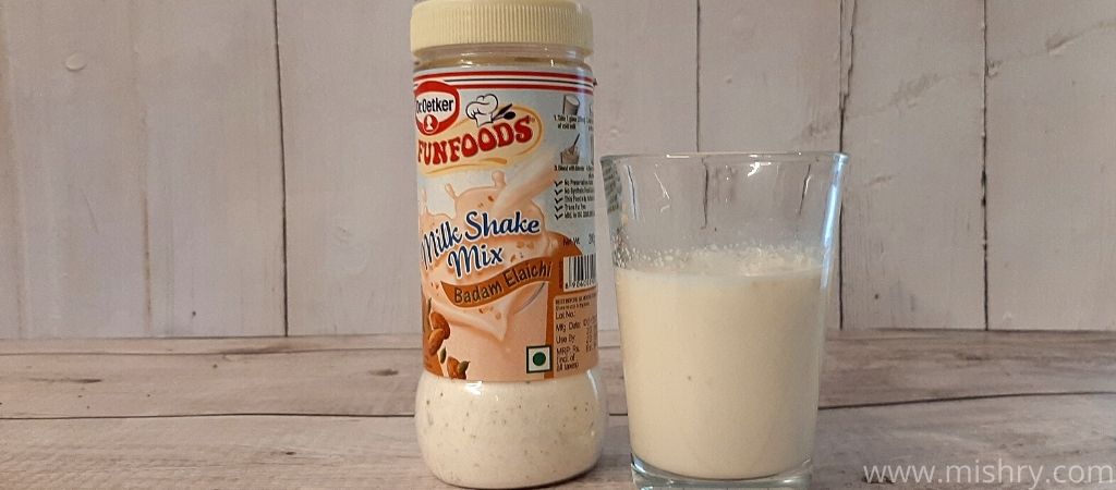 funfoods badam elaichi milk shake in a glass