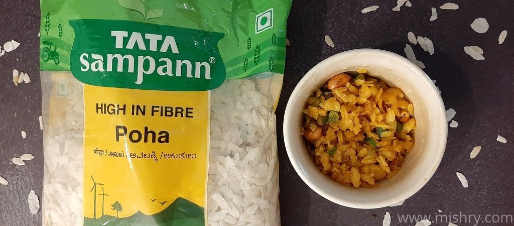 tata sampann poha packet with a bowl filled with cooked poha