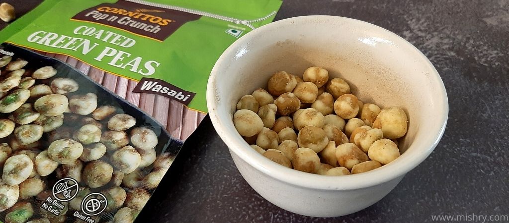 closer look at wasabi flavor green peas in a bowl