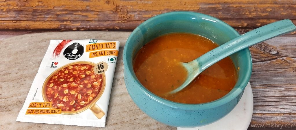 tomato oats soup in a bowl after stirring