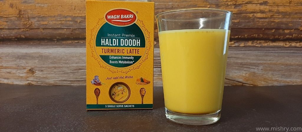 waghbakri turmeric latte in a glass after mixing in hot water
