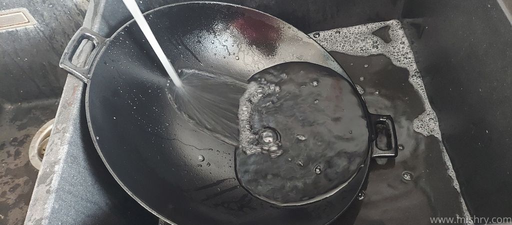 washing the pan before using it for cooking