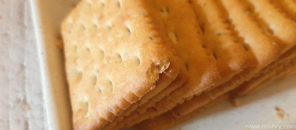 closer look at cremica ajwain cracker biscuits on a tray