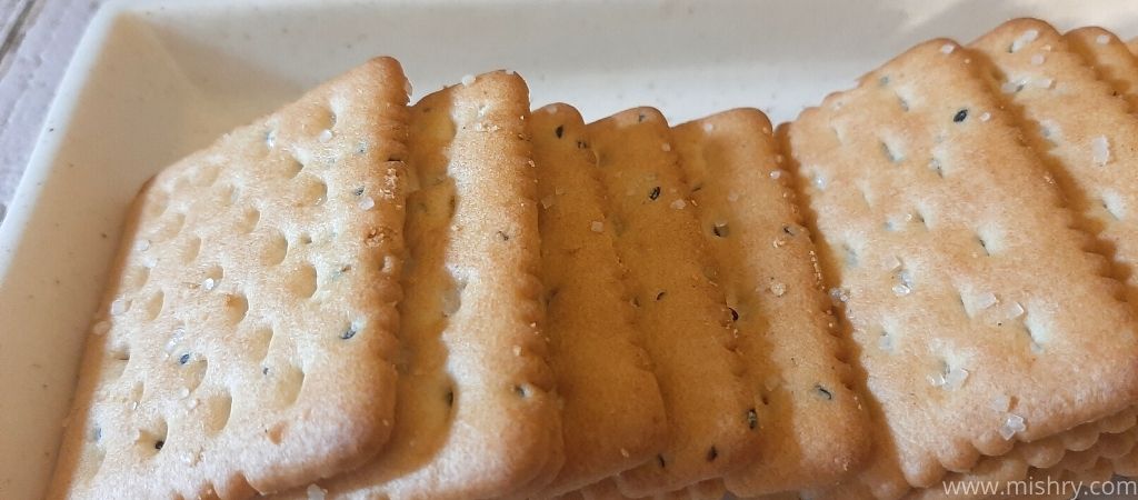 closer look at cremica kalonji cracker biscuits on a tray