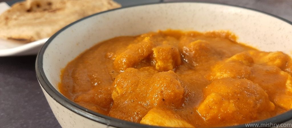 gravy made by using butter chicken masala in a bowl