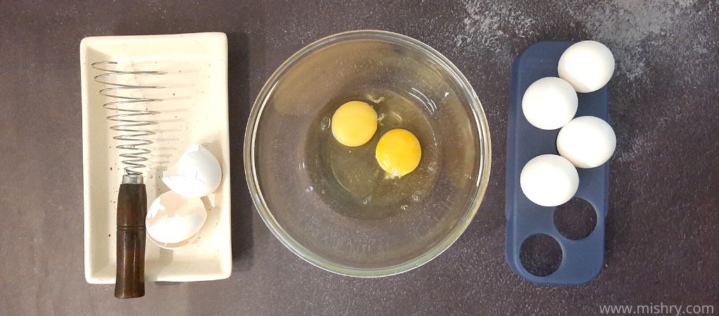 making an omelet using wire spiral egg whisk
