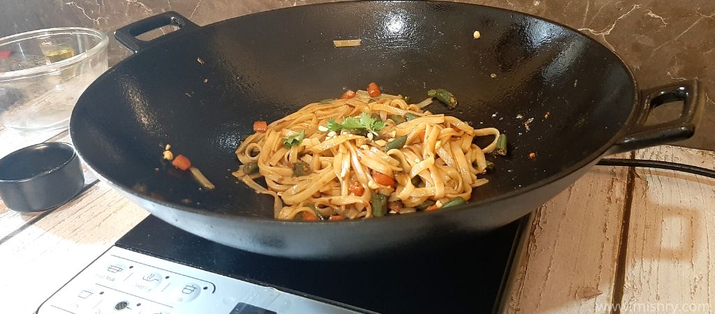 original pad thai noodles frying on pan