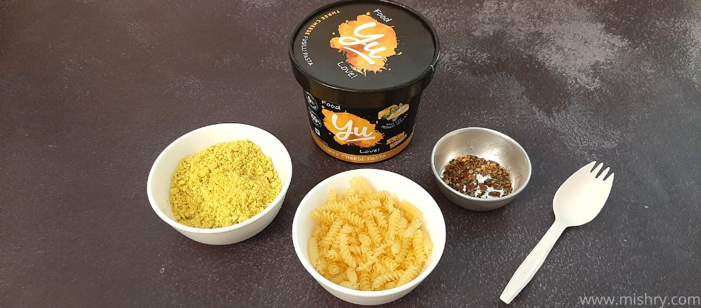 yu chunky three cheese pasta and powder for sauce in bowls