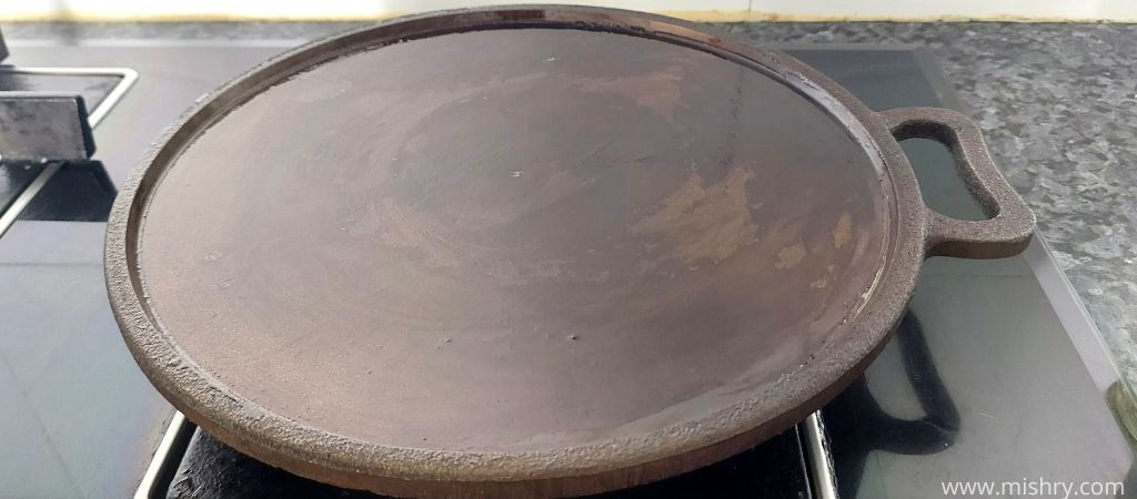 indus valley pre seasoned cast iron tawa on a gas stove