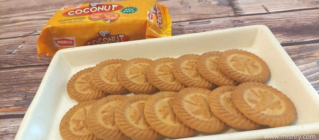 parle coconut crunchy cookies with real coconut placed in a tray
