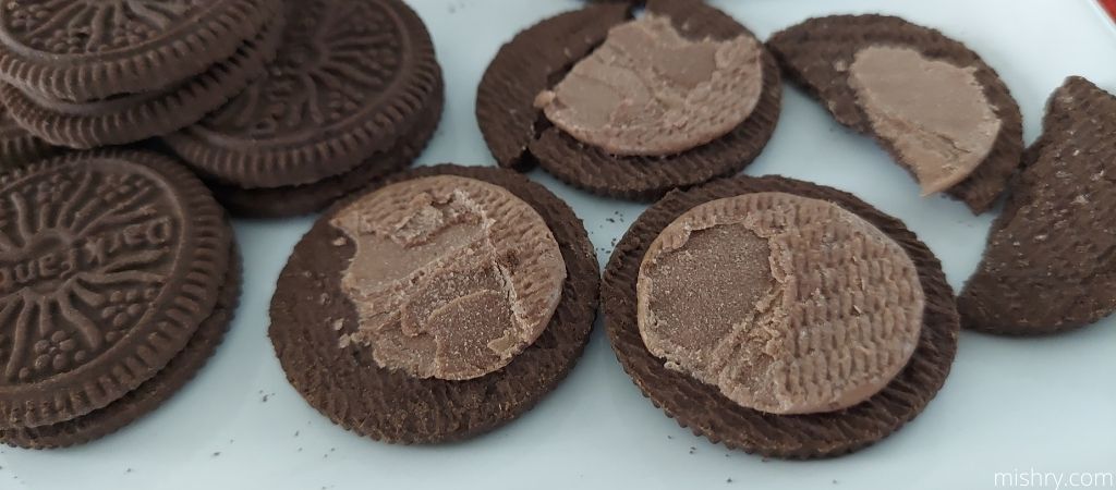 a close look at the chocolate cream inside the biscuits